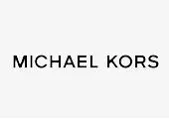 Paveikslėlyje vaizduojamas tekstas MICHAEL KORS juodomis, paryškintomis didžiosiomis raidėmis vienspalviame baltame fone.